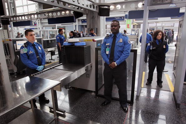 TSA officers staff a checkpoint at O'Hare International Airport on March 15, 2010 in Chicago, Illinois. Today TSA personnel are scheduled to begin using the  full-body scanners at the airport.