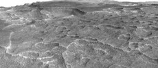 This vertically exaggerated view shows scalloped depressions in a part of Mars. These textures prompted researchers to check for buried ice.  (NASA/JPL-Caltech/University of Arizona)