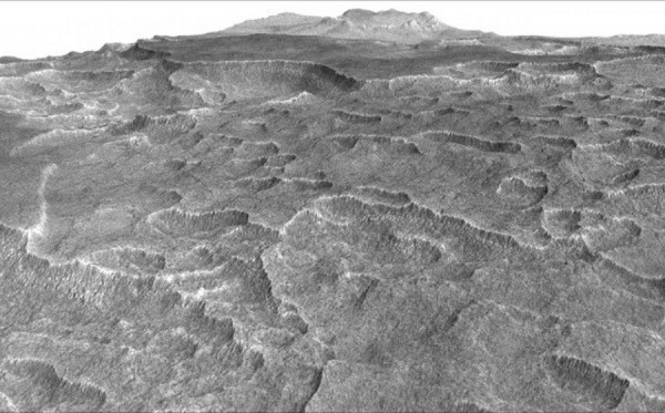 This vertically exaggerated view shows scalloped depressions in a part of Mars. These textures prompted researchers to check for buried ice.  (NASA/JPL-Caltech/University of Arizona)