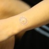 The new sweat-monitoring device measures four chemical components in sweat. (YouTube)