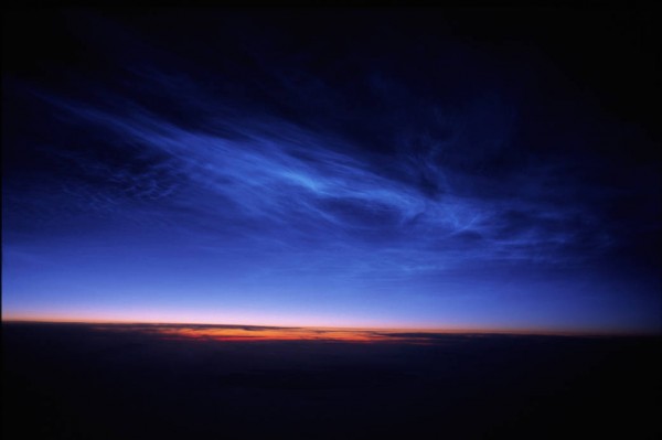 Noctilucent Clouds taken from 36,000 feet above the South of Nunivak Island, Alaska on June 20, 2006. (John Boardman/NASA)