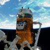 Japan’s Kounotori HTV-2 resupply ship is seen in March 2011 in the grips of the Canadarm2 robotic arm. (NASA/JAXA)