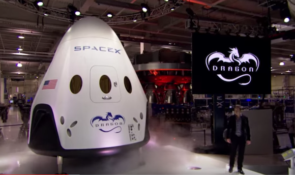 Elon Musk unveiling the Dragon V2 at an event. (YouTube)