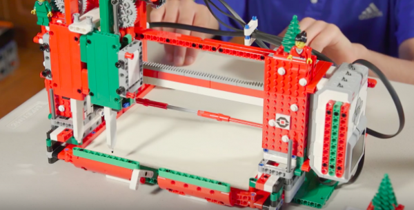 The "Holiday Plott3r" was built by brothers 14-year-old Sanjay and 12-year-old Arvind using Lego Mindstorm. (YouTube)