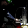 Scientists collecting water samples 2.4km underground in 2013 in the same mine the oldest water sample has been found. (YouTube)