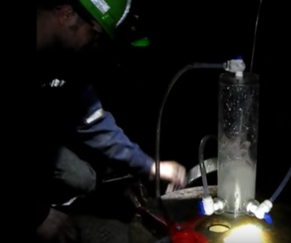 Scientists collecting water samples 2.4km underground in 2013 in the same mine the oldest water sample has been found. (YouTube)