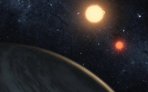 The gas giant Kepler-16b, nicknamed 'Tatooine,' orbits a pair of stars. One star is a small red dwarf star, the other is a larger K dwarf. (NASA/JPL-Caltech)