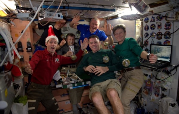 The ISS crew celebrating their Christmas meal. (NASA/ISS Twitter)