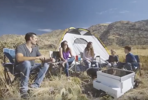 A family having a picnic with the Anywhere Fridge. (YouTube)