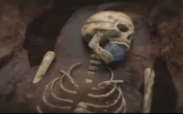 An image of the skeleton found with a stone in its mouth. (YouTube)