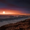 This artist’s impression shows a view of the surface of the planet Proxima b orbiting the red dwarf star Proxima Centauri, the closest star to the solar system. 