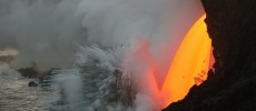 An open lava stream continues to pour out of the lava tube into the ocean. (USGS Hawaii Volcano Observatory)