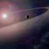 This artist's concept shows a massive, comet-like object falling toward a white dwarf.  (NASA, ESA, and Z. Levy (STScI))