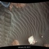 This image shows effects of one Martian day of wind blowing sand underneath NASA's Curiosity Mars rover on a non-driving day for the rover.