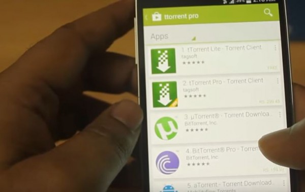 A smartphone displays search result for torrent app.