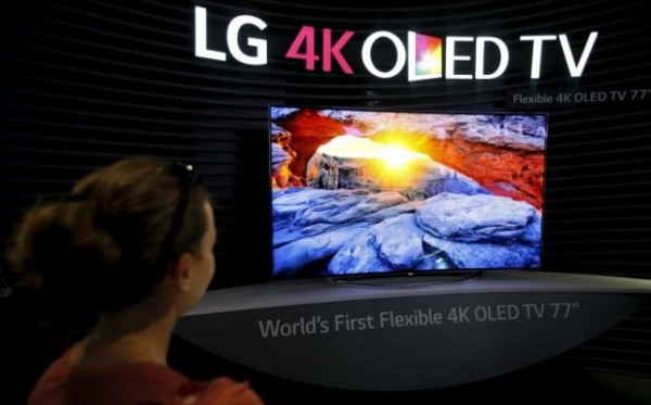 A visitor looks at LG 4K OLED TV screen at the IFA consumer technology fair in Berlin.