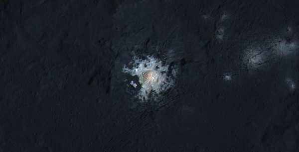 The bright spots in the center of Occator Crater on Ceres are shown in enhanced color in this view from NASA's Dawn spacecraft. (NASA/JPL-Caltech/UCLA/MPS/DLR/IDA/PSI/LPI)