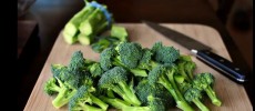 Broccolis are being prepared for cooking. 