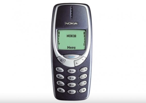 The original Nokia 3310 phone is seen on display. (YouTube)