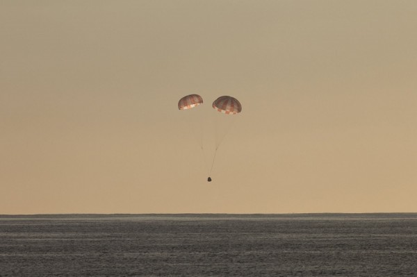 The SpaceX Dragon is pictured seconds before splashing down in the Pacific Ocean.