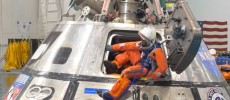 A space crew prepares to exit from the space capsule during a test. (YouTube)