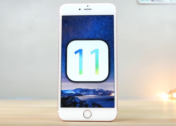  iPhone displays iOS 11 concept logo. 
