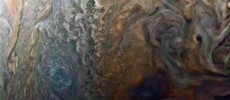 This enhanced-color image of a mysterious dark spot on Jupiter seems to reveal a Jovian “galaxy” of swirling storms.