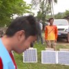 Volunteers and experts installing solar power generators in villages. (YouTube)