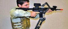 An assault rifle is fired using a prototype body-mount device.                 