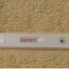 A pregnancy test kit displays positive. (YouTube)