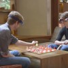 These guys are playing chess using an augmented reality device. (YouTube)
