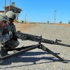 Marines and the new M2A1 .50 caliber heavy machine  gun.            
