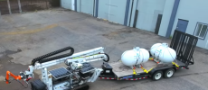 The Digital Construction Platform has  a vehicle carrying a large, industrial robotic arm that has a smaller, precision-motion robotic arm at its end. (YouTube)