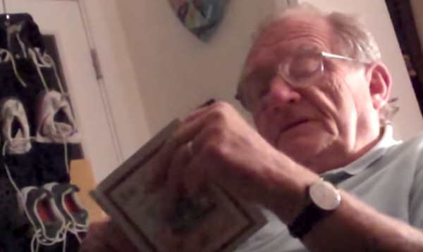 An old man fell asleep while reading his book. (YouTube)