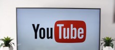 A YouTube logo is shown on a huge screen. 