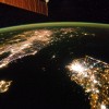 The Korean Peninsula at night. North Korea is almost completely dark, the bright spot is Pyongyang