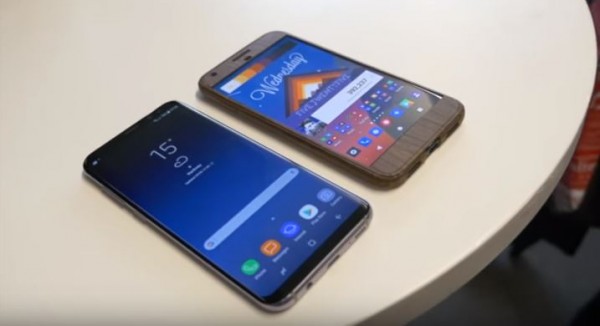  Two smartphones are placed on a platform to showcase its physical features. 