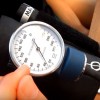 A person is manually measuring a blood pressure.