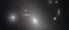 This image shows the elliptical galaxy NGC 4889 in front of hundreds of background galaxies, and deeply embedded within the Coma galaxy cluster.