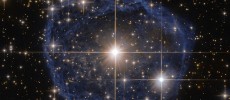 The distinctive blue bubble appearing to encircle WR 31a is a Wolf–Rayet nebula — an interstellar cloud of dust, hydrogen, helium and other gases.