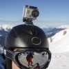 A GoPro camera is seen on a skier's helmet as he rides down the slopes.