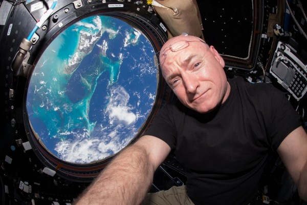 NASA astronaut Scott Kelly inside the cupola of the International Space Station, a special module that provides a 360-degree viewing of the Earth and the station.
