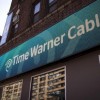A Time Warner Cable sign and logo are seen on the exterior of a Time Warner store.