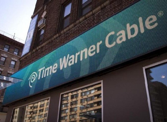 A Time Warner Cable sign and logo are seen on the exterior of a Time Warner store.