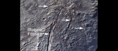 Pluto’s unusual spider-like feature consists of at least six extensional fractures that converge to a point. Individual fractures can reach hundreds of miles long and appear to expose a reddish subsurface layer.