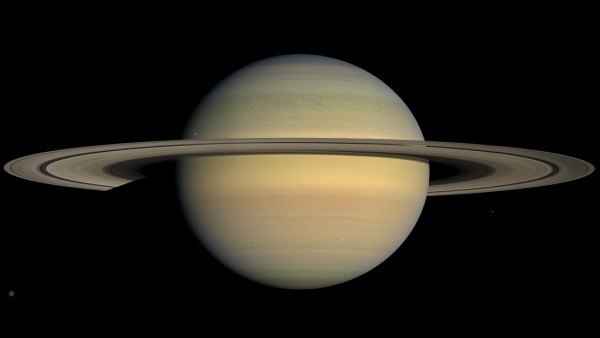 Saturn as seen by NASA's Cassini spacecraft in 2008. Long-term tracking of the spacecraft's position has revealed no unexplained perturbations in Cassini's orbit.