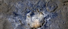 Ceres' Haulani Crater, with a diameter of 21 miles (34 kilometers), shows evidence of landslides from its crater rim. 