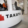 A logo of Takata Corp is seen with its display at a showroom for vehicles in Tokyo, Japan.