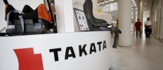 A logo of Takata Corp is seen with its display at a showroom for vehicles in Tokyo, Japan.