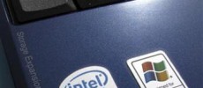An Intel Inside sticker is shown next to a Windows XP sticker on an Acer Netbook.
